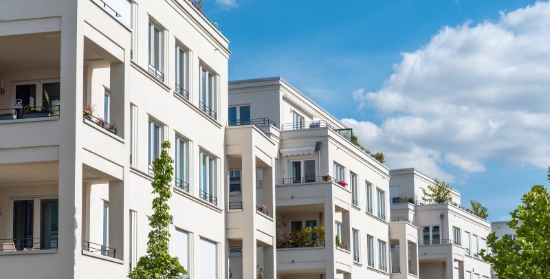 Row of white modern apartment houses seen in Berlin, Germany