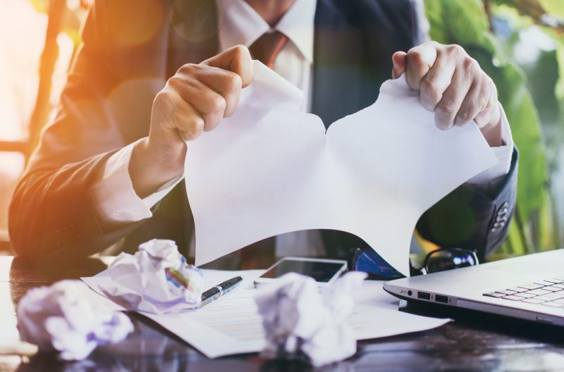 Businessman tearing contract