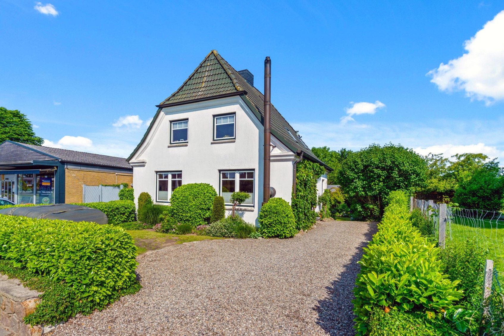 Immobilienangebot - Süderbrarup - Alle - Zentral in Süderbrarup: sehr gepflegetes EFH mit traumhaft angelegtem Garten & gutem Grundriss!