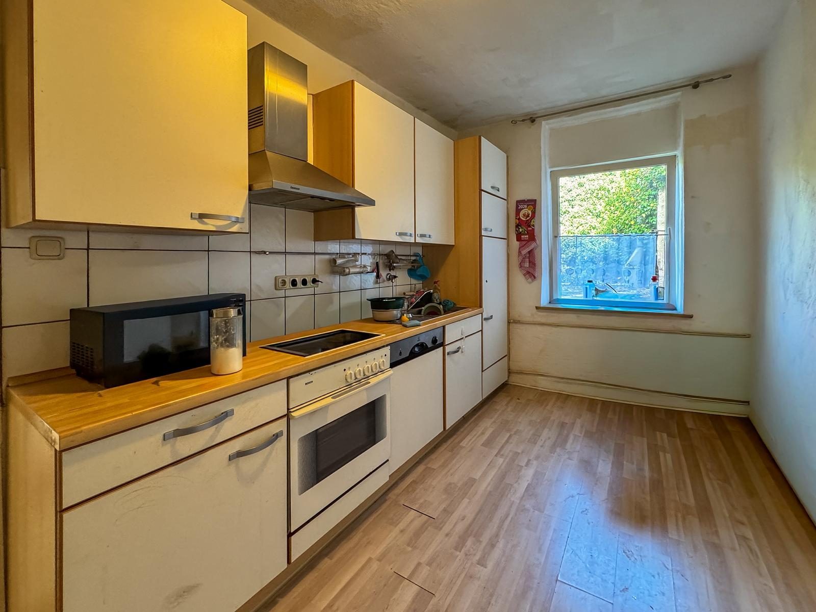 Immobilienangebot - Jüchen - Alle - Jüchen-Hochneukirch: Wohn- und Geschäftshaus mit Entwicklungspotenzial auf großzügigem Grundstück