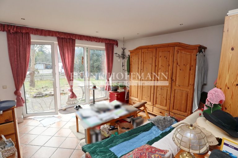 Immobilienangebot - Hartenholm - Alle - Teilvermietetes Einfamilienhaus mit Einliegerwohnung in schöner Lage von Hartenholm
