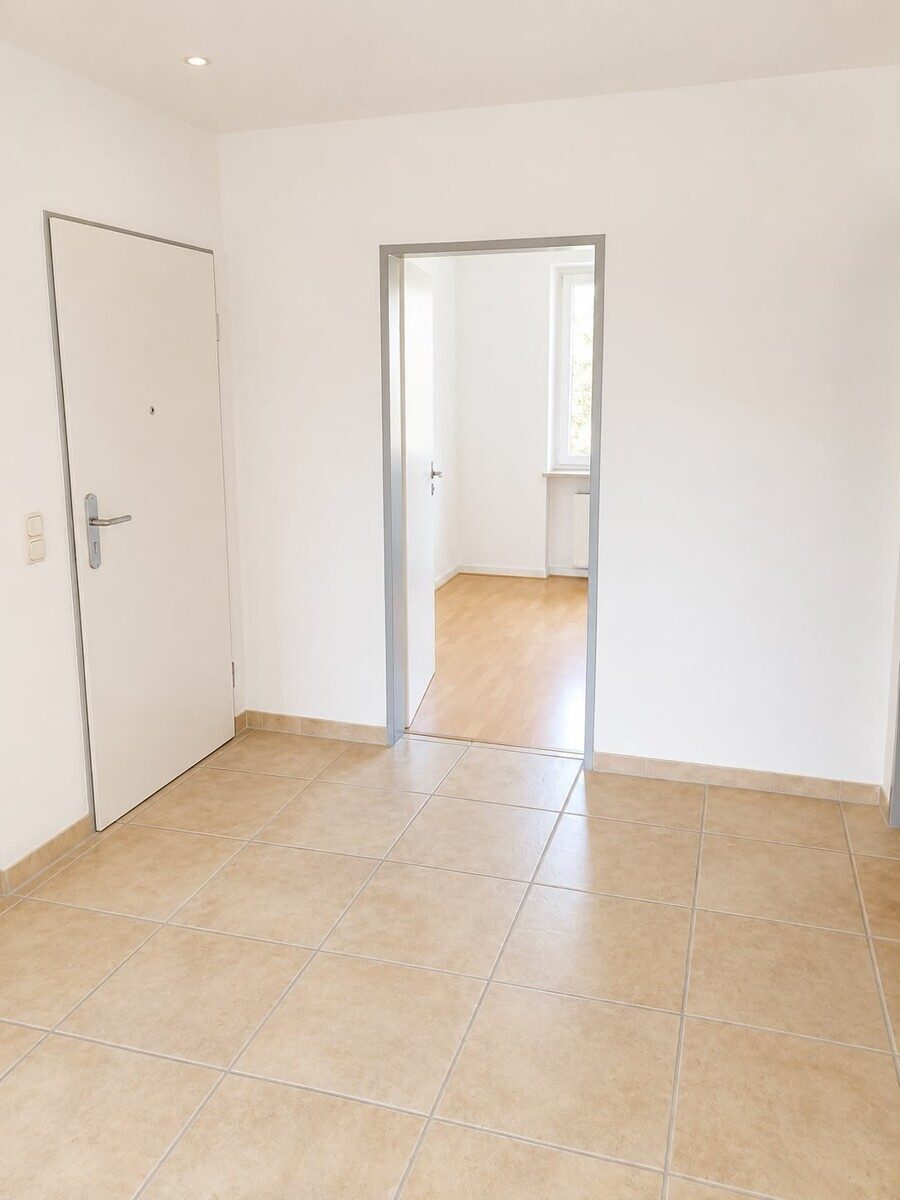 Immobilienangebot - Hasloh - Alle - Gepflegte & Vermietete 2,5-Zimmer-Eigentumswohnung mit Balkon & zwei Stellplätzen in Hasloh
