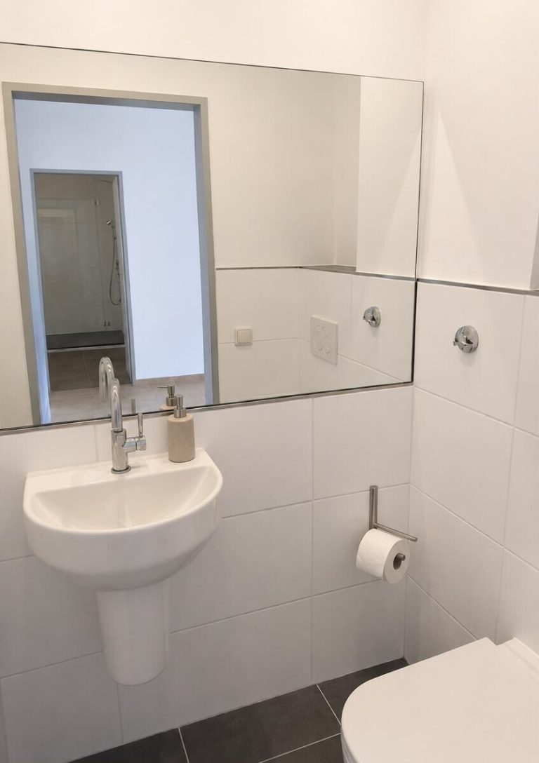 Immobilienangebot - Hasloh - Alle - Gepflegte & Vermietete 2,5-Zimmer-Eigentumswohnung mit Balkon & zwei Stellplätzen in Hasloh