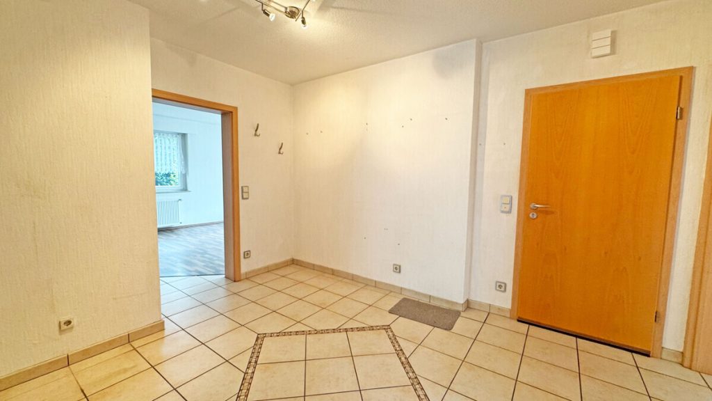 Volksbank Immobilien Niederrhein GmbH - Immobilienangebot - Voerde - Alle - Komfortable Erdgeschosswohnung mit Terrasse, Kamin und großem Gemeinschaftsgrundstück in Spellen!