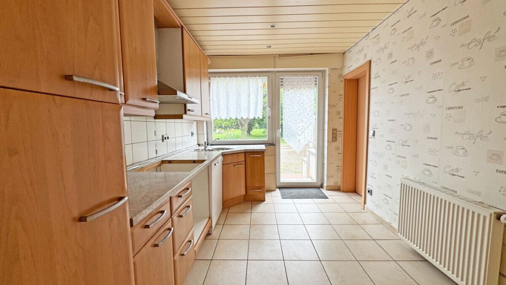 Volksbank Immobilien Niederrhein GmbH - Immobilienangebot - Voerde - Alle - Komfortable Erdgeschosswohnung mit Terrasse, Kamin und großem Gemeinschaftsgrundstück in Spellen!