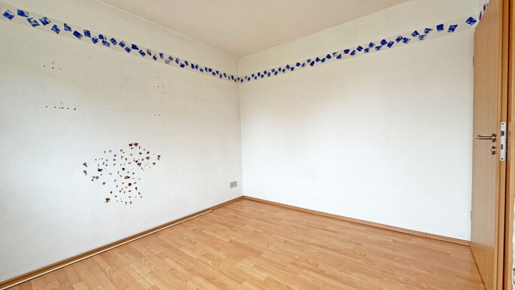 Volksbank Immobilien Niederrhein GmbH - Immobilienangebot - Voerde - Alle - Komfortable Erdgeschosswohnung mit Terrasse, Kamin und großem Gemeinschaftsgrundstück in Spellen!