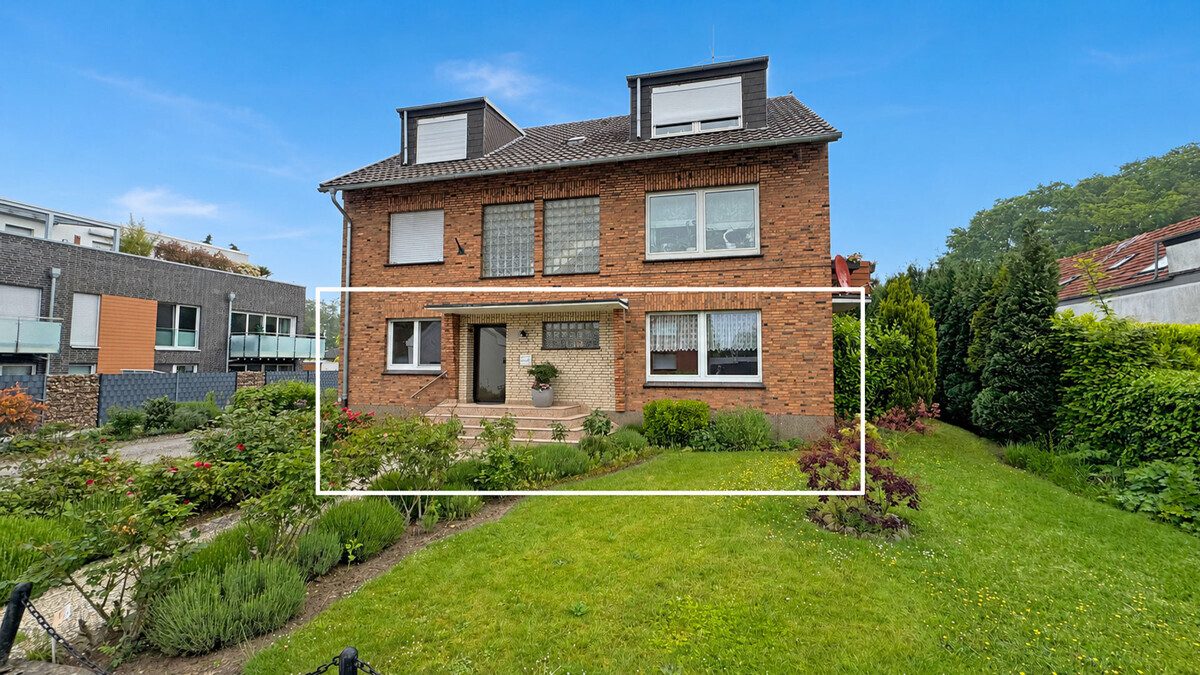 Volksbank Immobilien Niederrhein GmbH - Immobilienangebot - Voerde - Alle - Komfortable Erdgeschosswohnung mit Terrasse, Kamin und großem Gemeinschaftsgrundstück in Spellen!