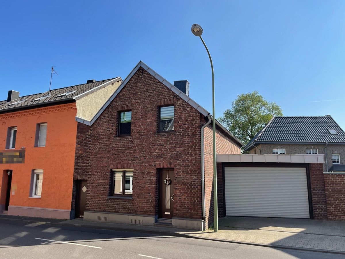 Immobilienangebot - Baesweiler - Wohnen - Vermietetes Einfamilienhaus mit Garage und Süd-Garten