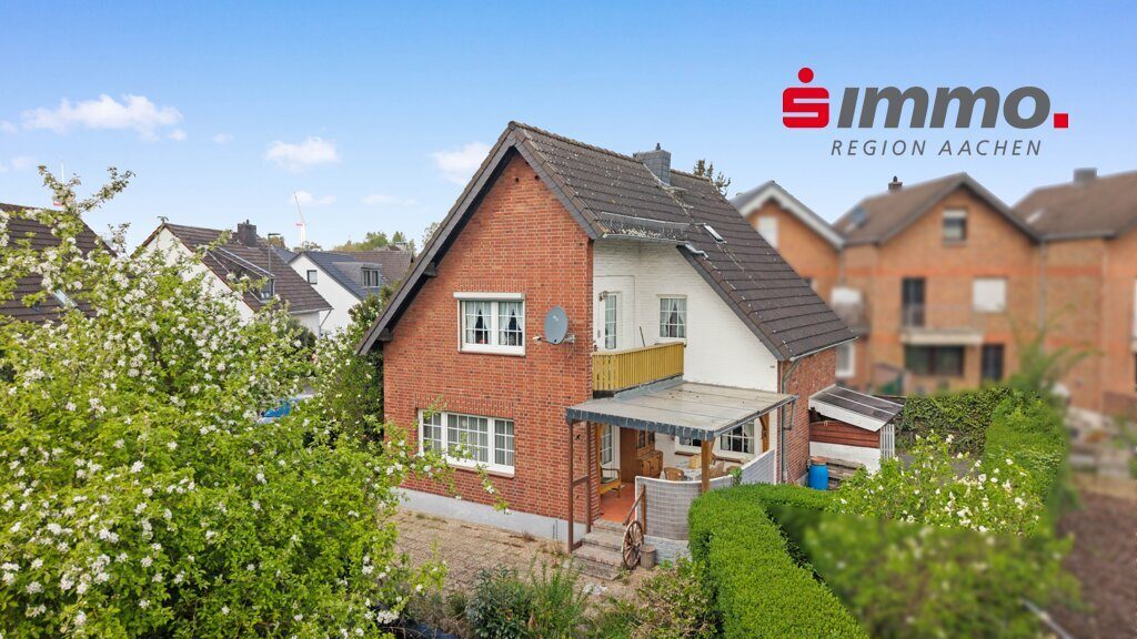 Immobilienangebot - Baesweiler - Wohnen - Freistehendes Einfamilienhaus mit großer Doppelgarage