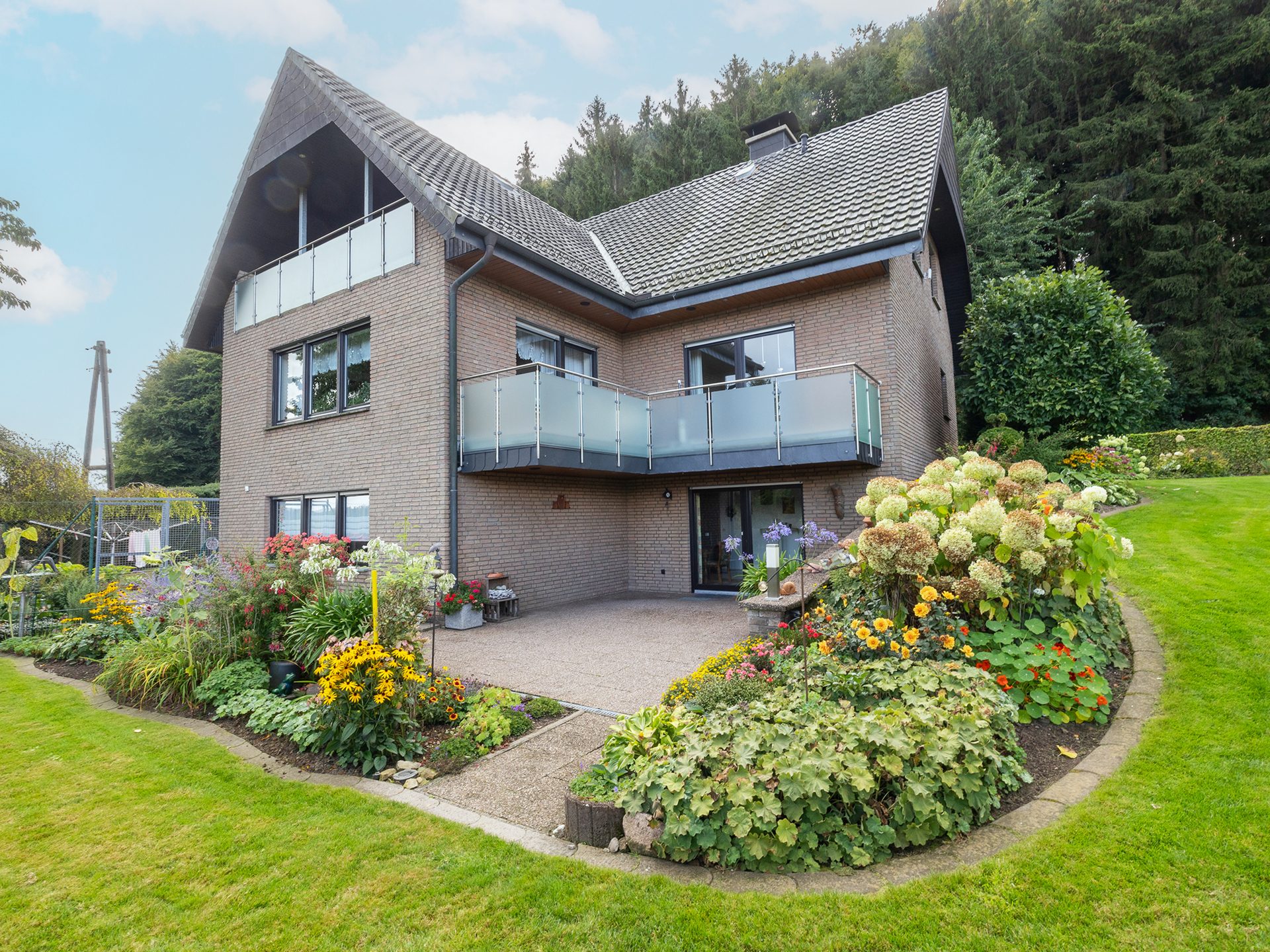Immobilienangebot - Hilter am Teutoburger Wald - Alle - Großzügiges Einfamilienhaus trifft auf ruhige Waldrandlage in Hilter