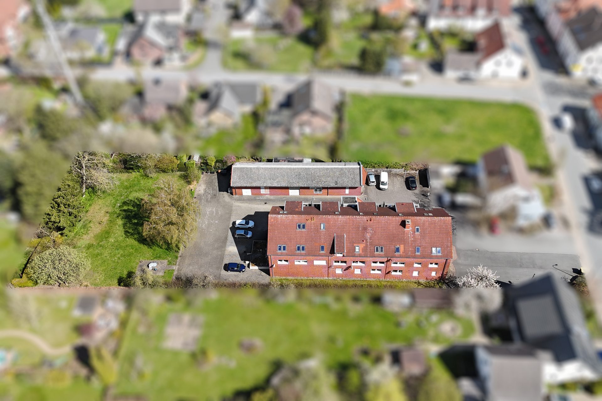 Immobilienangebot - Melle / Neuenkirchen - Alle - Vollvermietetes Renditeobjekt: 12 Wohneinheiten und eine Lagerhalle in Melle-Neuenkirchen!