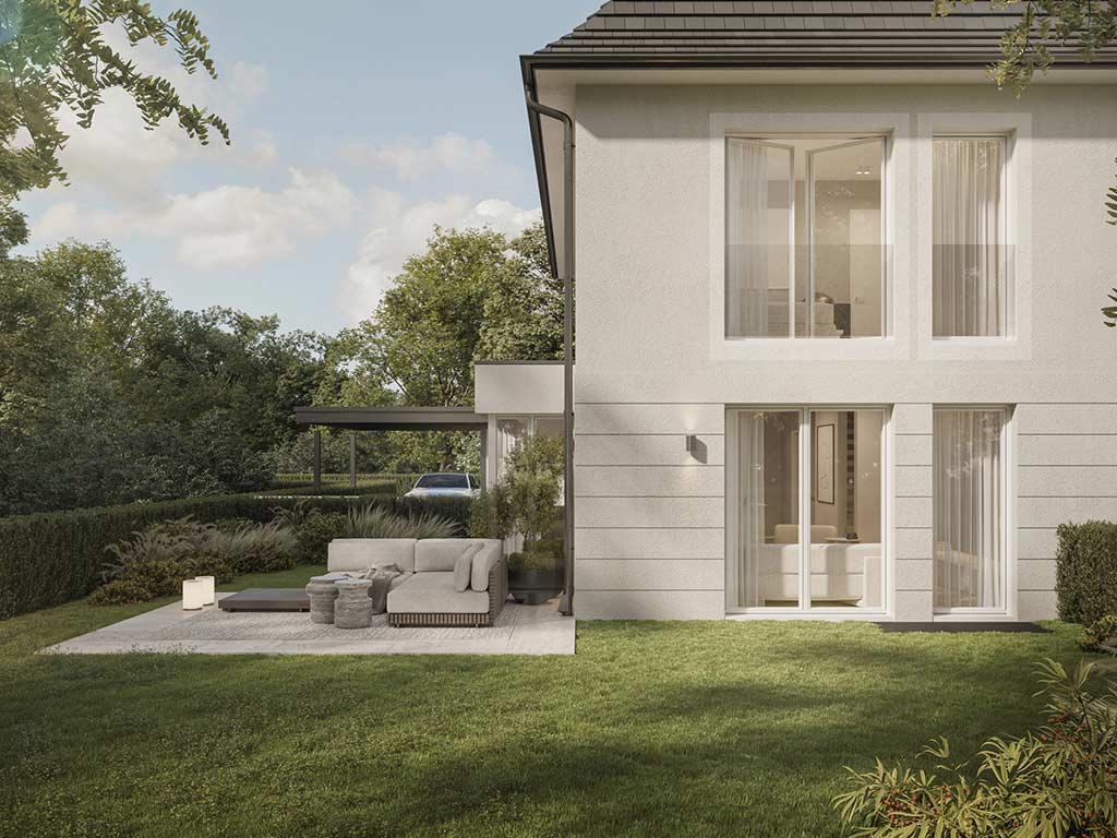 Ein weißes, zweistöckiges Neubau Haus mit anthrazit farbenem Dach