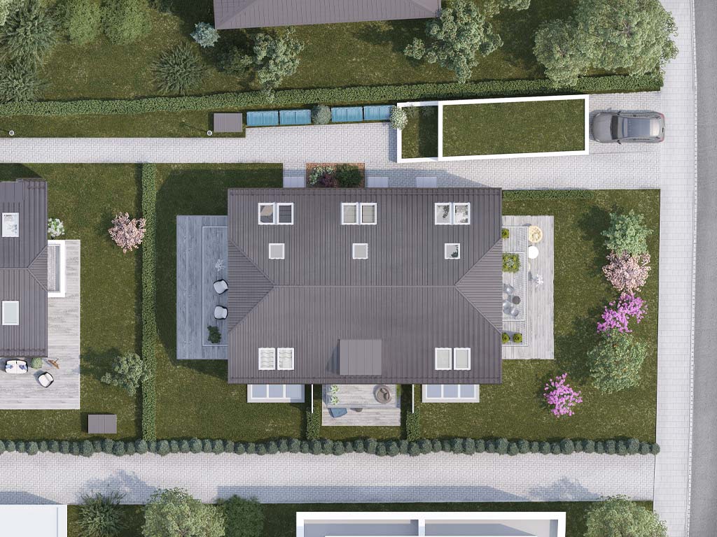 Blick auf ein Neubau-Einfamilienhaus von oben mit grauem Krüppeldach