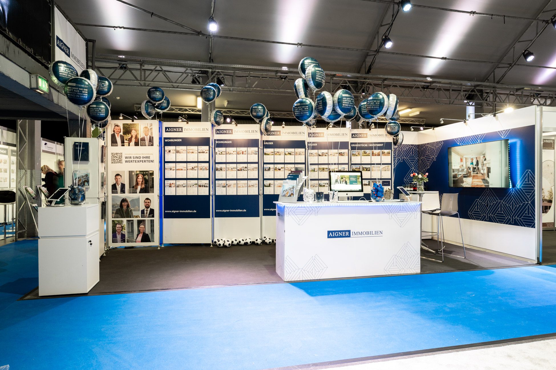 Der Stand von Aigner Immobilien auf der Münchner Immobilien Messe 2025