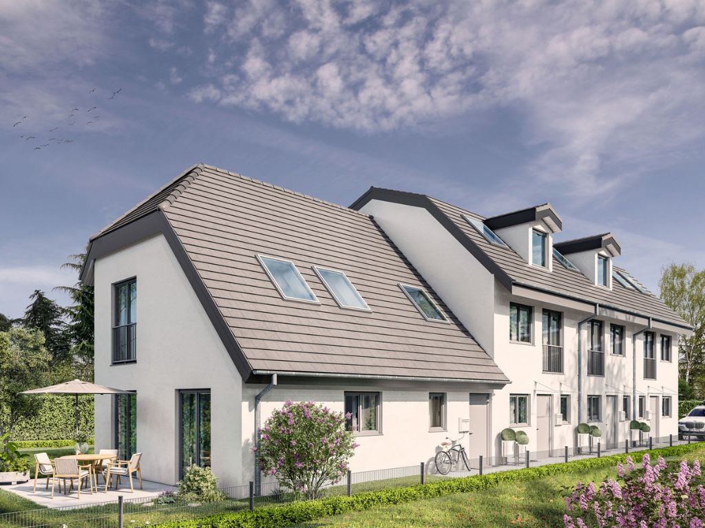 Perspektive mehrerer moderner Stadthäuser mit Satteldächern, Dachgauben und großen Fenstern vor blauem Himmel im Neubau