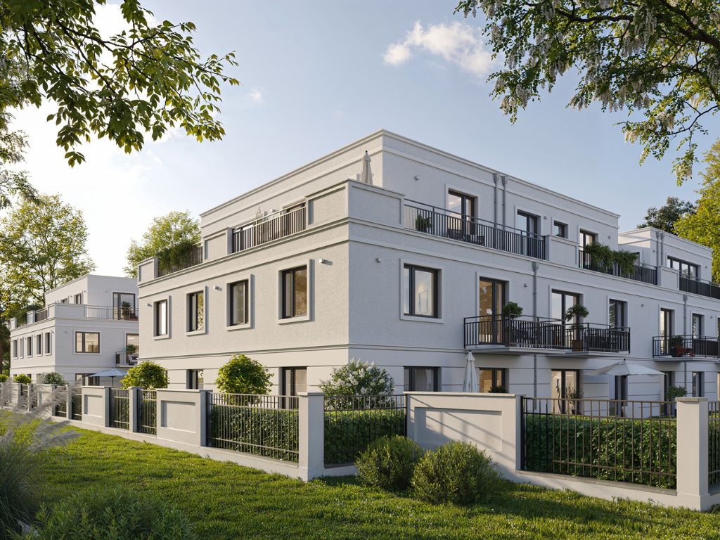 Moderne Neubau-Wohnanlage in München mit Balkonen, großen Fenstern und gepflegtem Vorgarten bei sonnigem Wetter
