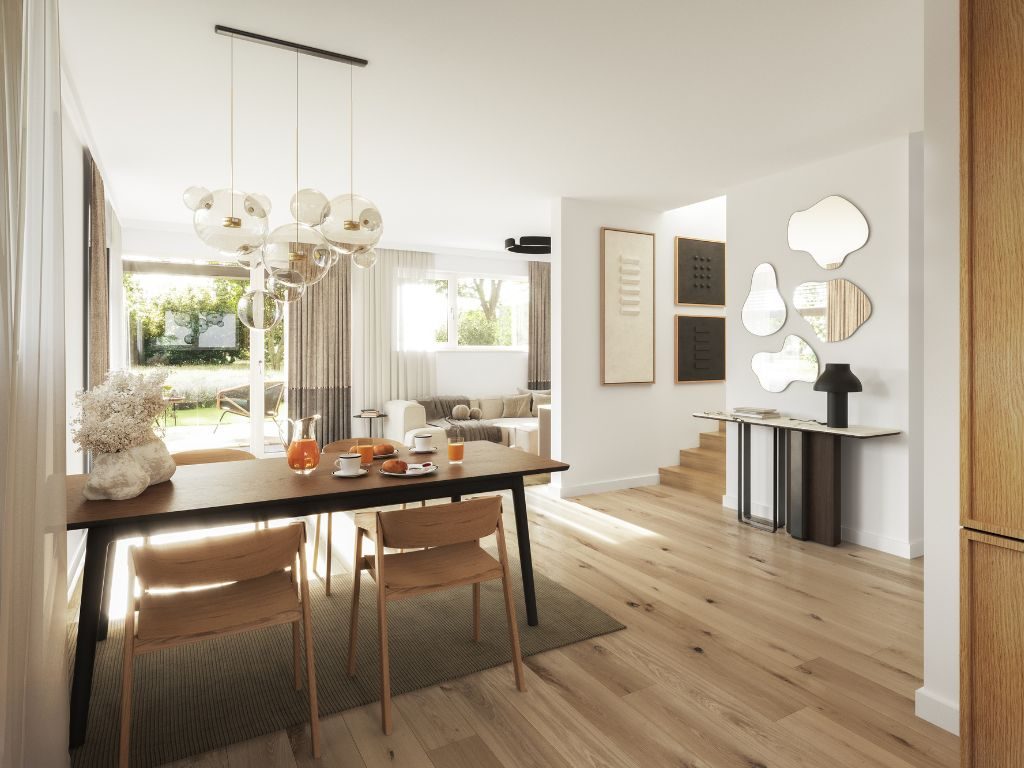 Helles, modern eingerichtetes Esszimmer mit großem Esstisch und Blick in den Garten in einem Münchner Neubauprojekt.