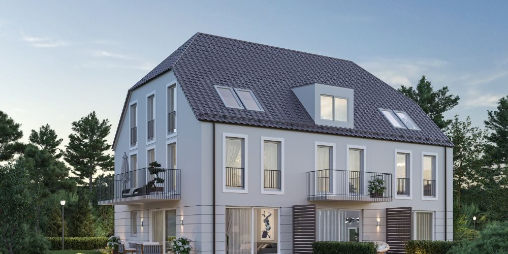 Elegantes Neubauhaus mit großzügigen Balkonen und modernem Design, umgeben von grüner Natur in München
