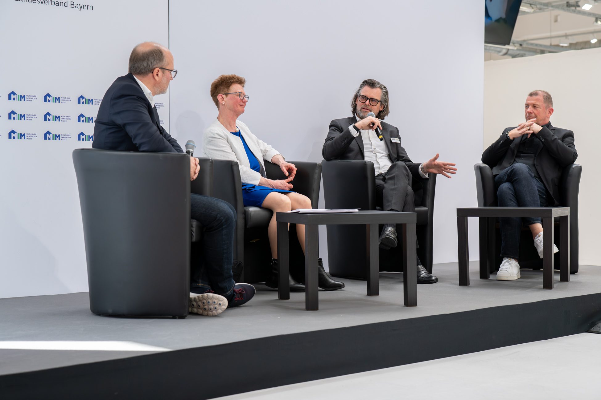 Thomas Aigner auf der Münchner Immobilien Messe bei einer Podiumsdiskussion