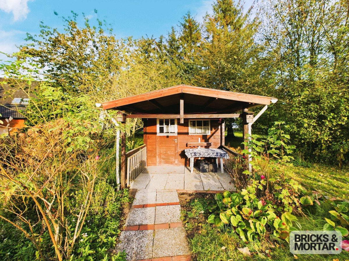 Immobilienangebot - Böel - Alle - Gepflegter Winkelbungalow auf sonnigem großen Grundstück