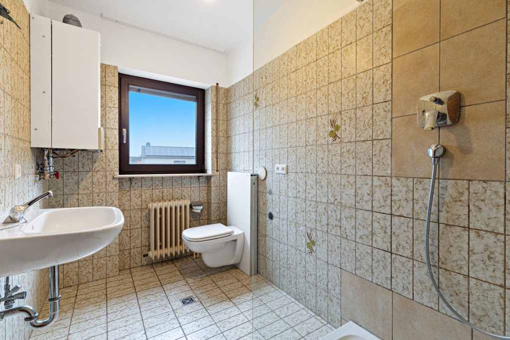 HUST Immobilien GmbH & Co. KG - Immobilienangebot - Sinzheim / Kartung - Alle - Gepflegtes Mehrfamilienhaus mit 12 Wohnungen in Sinzheim / Kartung bei Baden-Baden