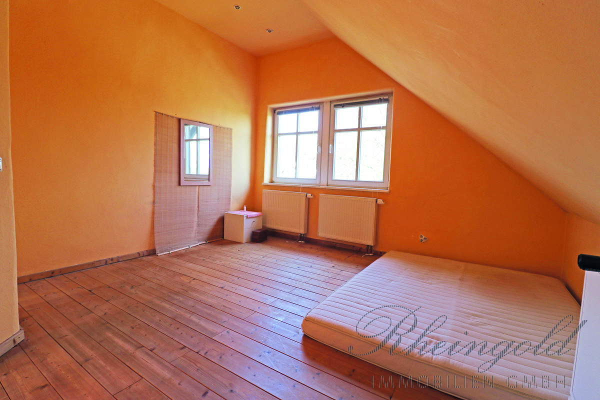 Immobilienangebot - Bergisch Gladbach - Häuser - Am Landschaftsschutzgebiet: Große Fenster & viel Licht: Platz für die Familie, mit Einliegerwohnung
