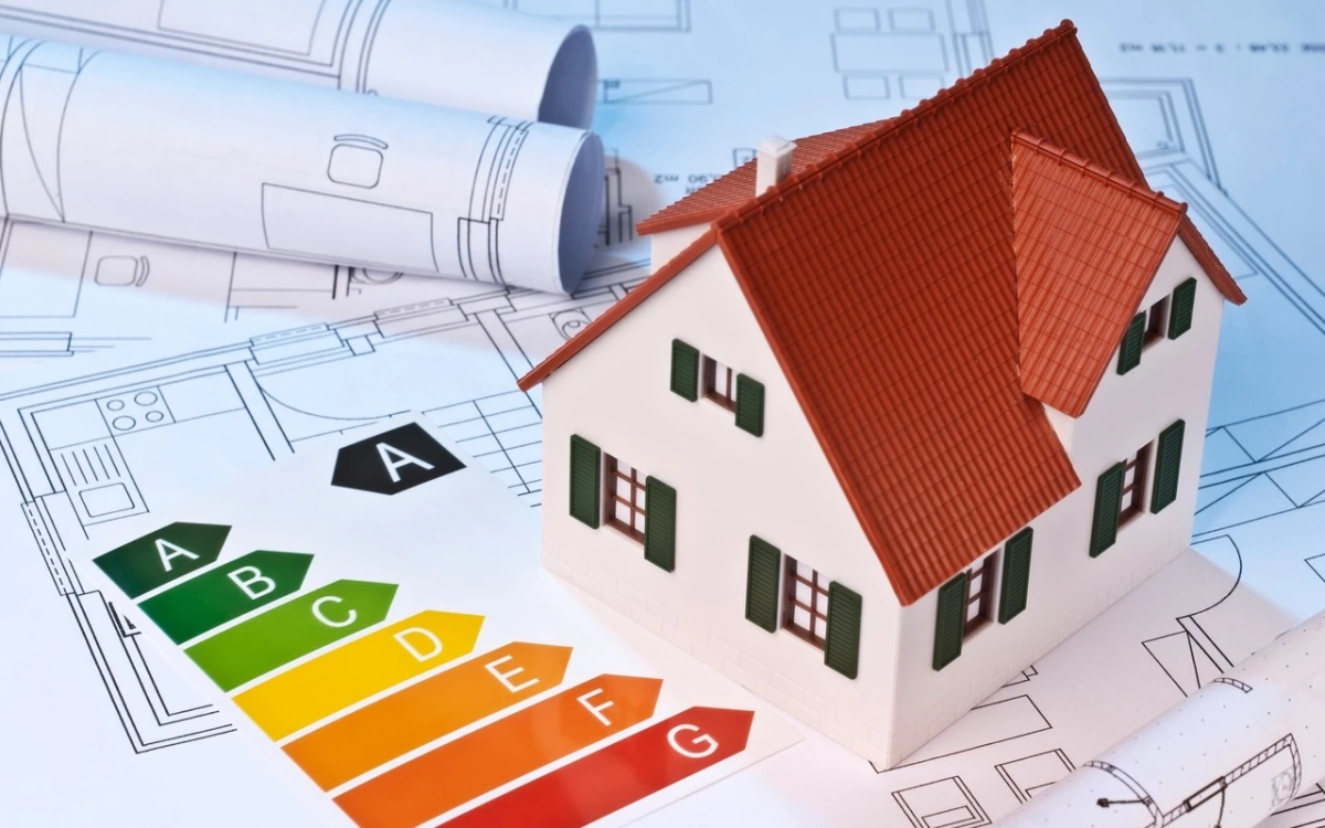 Haus mit einer Energieskala - Energieausweis mit Krebs Immobilien