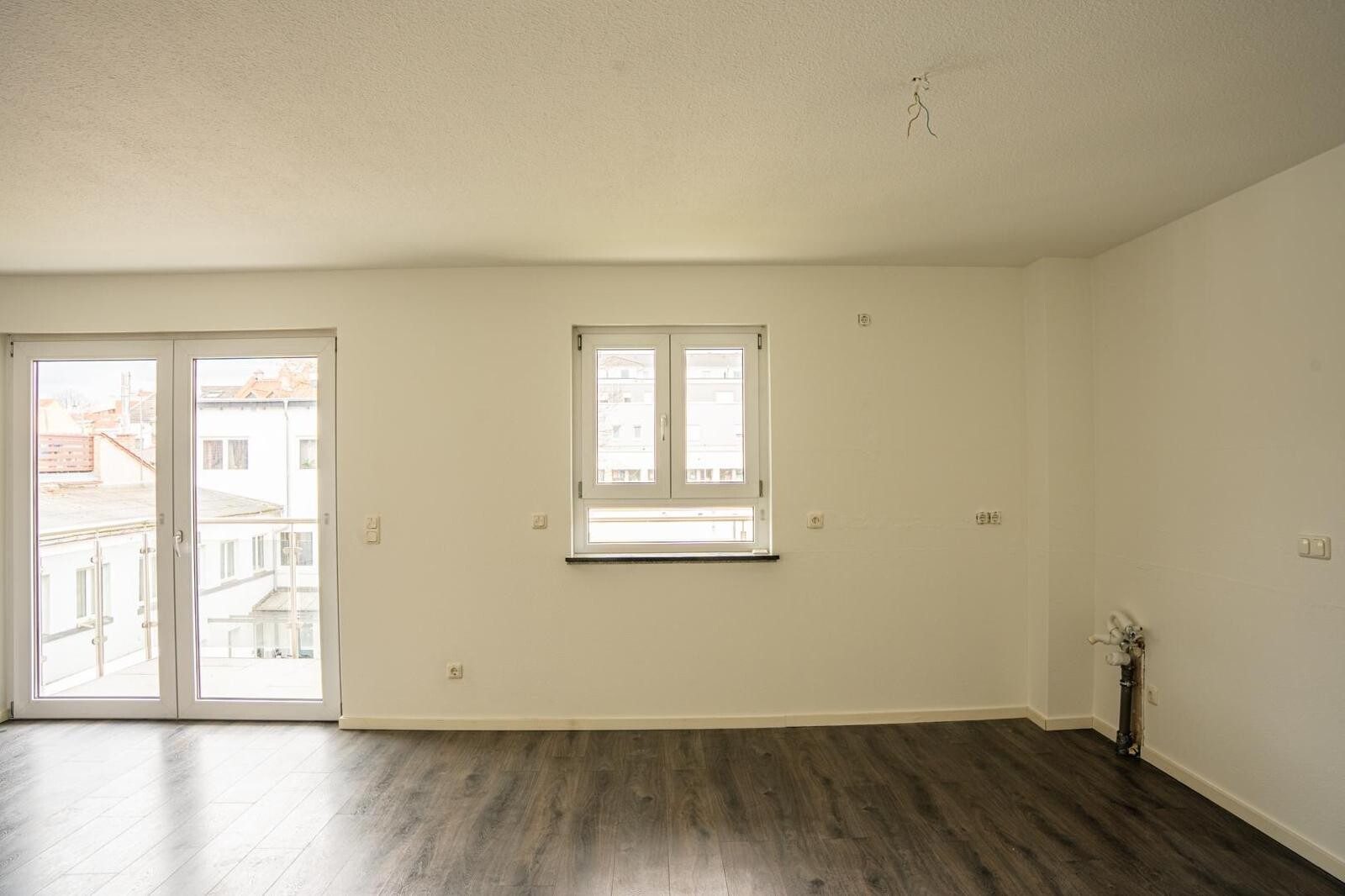 Immobilienangebot - Offenbach - Alle - Großzügige 3-Zimmer-Erdgeschosswohnung mit Balkon und Gartennutzung im KfW-70-Haus